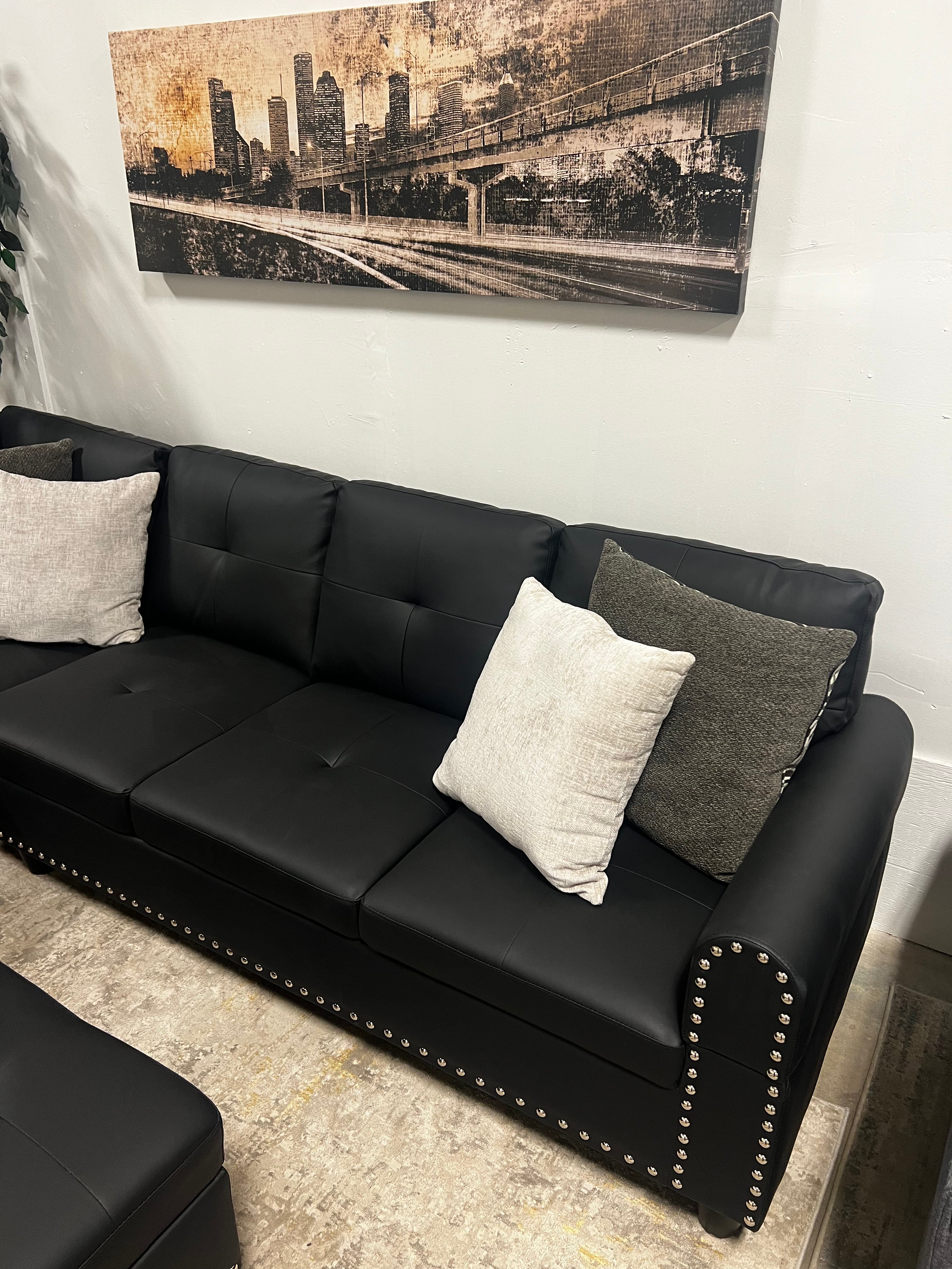 Faux Leather Sectional with Pull-Out Cupholders & Storage Ottoman